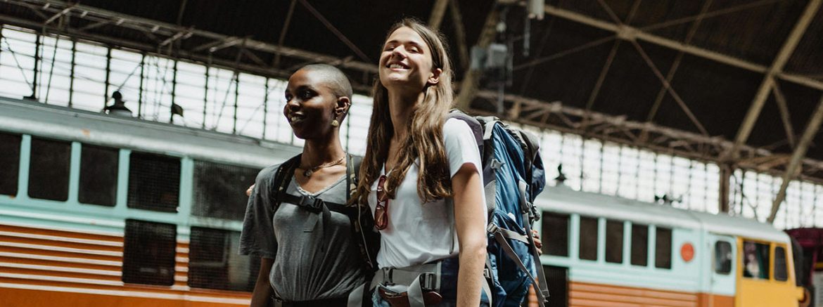 Femail backpackers in train station
