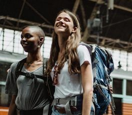 Femail backpackers in train station