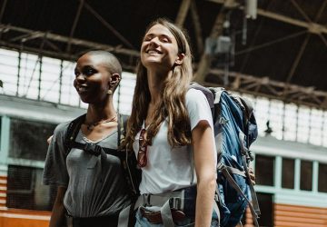 Femail backpackers in train station